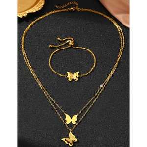 Detailed view of golden double-layer butterfly necklace and adjustable matching bracelet