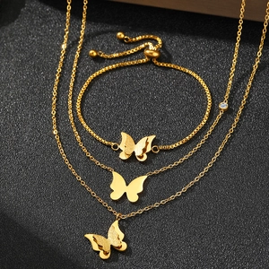 Golden double-layer butterfly jewelry set featuring necklaces and adjustable bracelet