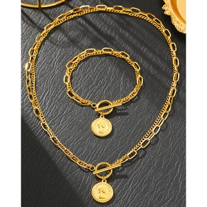 Vintage gold necklace and bracelet set with queen coin pendants and toggle clasps