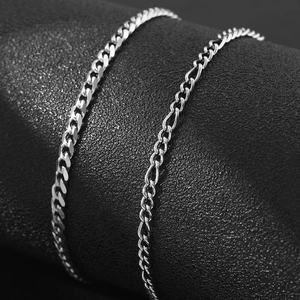 Double layer silver stainless steel curb and figaro chain anklet on black texture