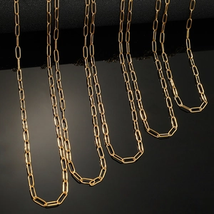 Gold plated thick paperclip chain necklace for men and women on black background