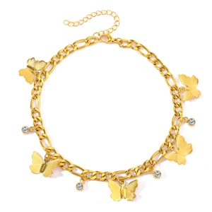 Golden butterfly anklet with Figaro chain and sparkling rhinestones on white background