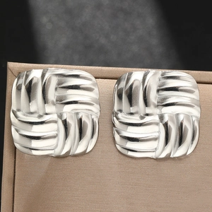 Square stainless steel stud earrings with textured woven geometric pattern in silver finish