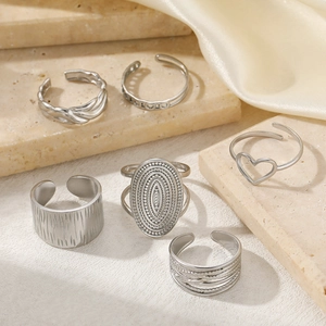 6-piece silver geometric ring set with heart and textured designs on stone