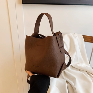 Brown litchi texture leather bucket bag with top handle and adjustable shoulder strap
