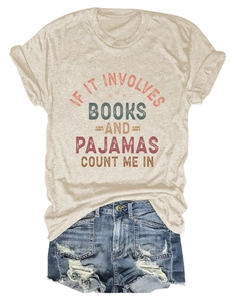 Flat lay of beige cotton t-shirt with book quote and distressed denim fringe shorts