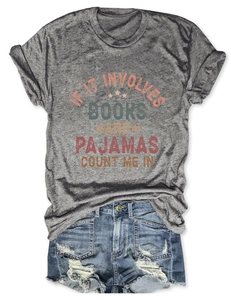 Flat lay of gray T-shirt with book quote print and distressed denim shorts