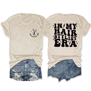 Detail of Hair Stylist Era graphic print on a beige vintage style cotton t-shirt