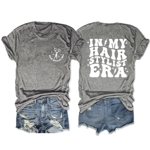 Front and back detail of grey hair stylist era t-shirt with scissors and lightning graphic