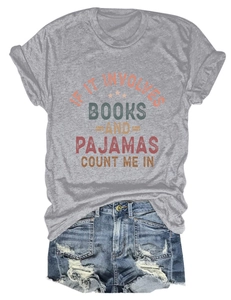 Women's casual grey t-shirt with book print paired with distressed denim shorts