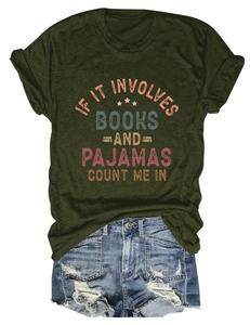 Detail of army green t-shirt with book slogan print and distressed denim shorts