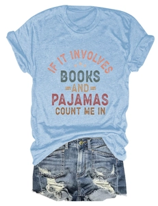 Flat lay of a blue bookish graphic tee and frayed denim shorts set on white background