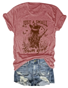 Flat lay of vintage reddish-brown graphic t-shirt and ripped light blue denim shorts