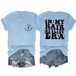 Detailed front and back view of light blue hair stylist era t-shirt and denim shorts