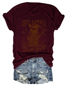 Detail of burgundy T-shirt with vintage girl print and distressed blue denim shorts
