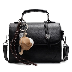 Vintage black faux leather Cambridge handbag with baseball charms and crossbody strap