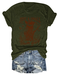 Flat lay of olive green cotton t-shirt with retro slogan and distressed denim shorts