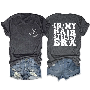 Dark gray hair stylist era t-shirt and denim shorts flat lay outfit set