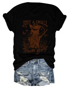 Detailed flat lay of t-shirt with girl graphic and distressed denim shorts with frayed hems