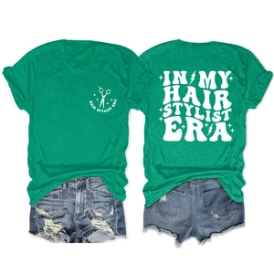 Front and back view of a green hair stylist t-shirt set with blue denim shorts