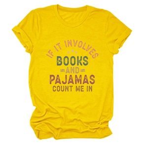 Detail of ginger yellow t-shirt with 'IF IT INVOLVES BOOKS' slogan and soft fabric texture