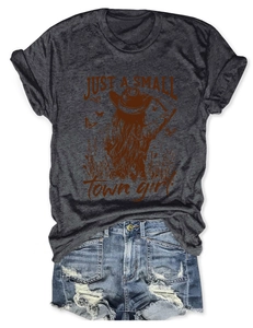 Detail of vintage Just a Small Town Girl print on dark gray t-shirt with ripped denim shorts