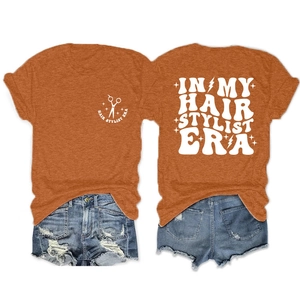 Detail view of the retro hair stylist print on a comfortable orange crew neck t-shirt