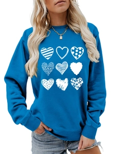 Detail of creative multi-style heart prints on blue round neck sweatshirt for women