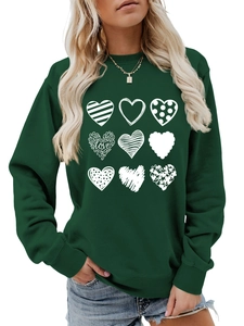 Detail of dark green crewneck sweatshirt with nine artistic heart prints and love text