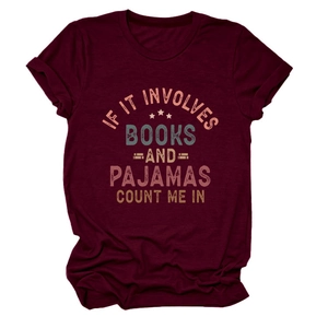 Detail of burgundy crew neck tee with 'Books and Pajamas' print and rolled sleeves