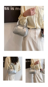 Detail of silver metallic bowling bag with sturdy handles and polished PU finish