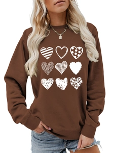 Detail of nine heart patterns and love text print on brown crewneck sweatshirt