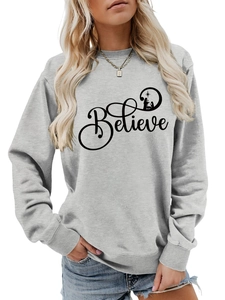 Detail of grey crewneck sweatshirt with Believe text and Nativity silhouette print