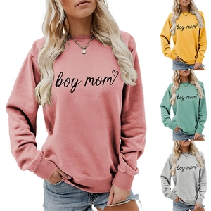 Close-up of boy mom heart print on round neck sweatshirts in pink, yellow, and green