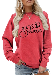 Detail of red crewneck sweatshirt with Believe nativity print and ribbed cuffs