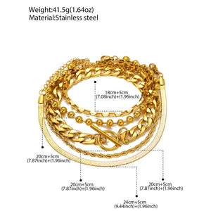 Detail of 5-piece gold stainless steel layered bracelets with Cuban chains and OT buckles