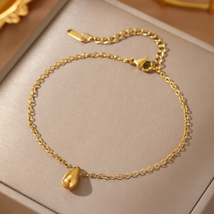 Detail of adjustable gold teardrop bracelet with lobster clasp and S.Steel hallmark