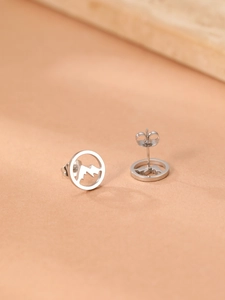 Detailed close-up of silver mountain range stud earrings with butterfly backings