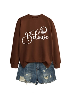 Detail of Believe printed brown sweatshirt and distressed blue denim shorts set
