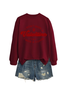 Flat lay of maroon crewneck sweatshirt with coffee print and ripped denim shorts