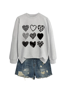 Detail of grey crewneck sweatshirt with nine heart prints and love typography design