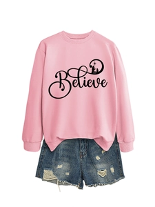 Pink crewneck sweatshirt with Believe nativity print styled with blue denim shorts