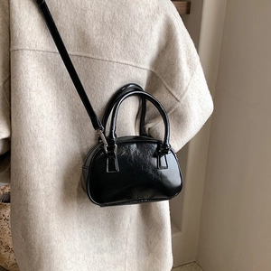 Classic black shiny leather Boston handbag with detachable strap for crossbody wear