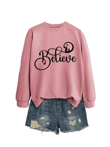 Pink crew neck sweatshirt featuring Believe print with nativity silhouette and denim shorts