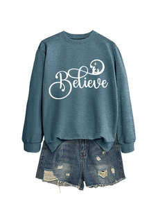 Detail of blue Believe sweatshirt with Christmas nativity silhouette and ripped denim shorts