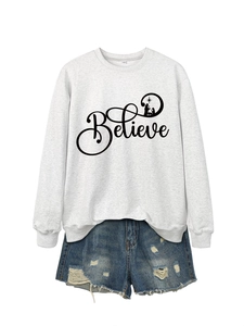 Close-up of light grey Believe graphic sweatshirt with distressed denim shorts