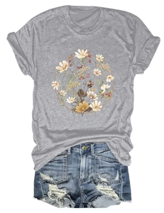 Flat lay of gray crew neck t-shirt with wildflower print and distressed denim shorts