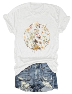 Detail of floral wreath print on white cotton T-shirt with frayed denim shorts