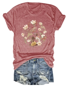 Detail of floral wreath print on a brick red crew neck t-shirt with denim shorts