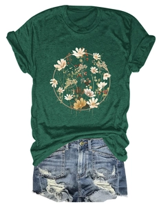 Detailed view of floral print t-shirt paired with distressed denim shorts on white background